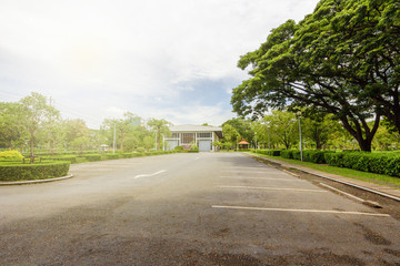 View of the parking lot in a natural park surrounded by big trees