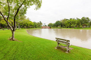 View of city park with exercise path surrounded by nature.