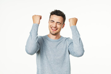 happy man with arms raised