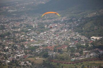 Paraglider Playing Paralayang Sport In Batu City East Java Indonesia