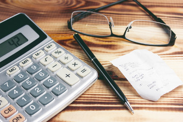 calculator and check on the table. shopping calculation