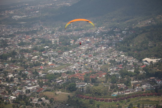 Paraglider Playing Paralayang Sport In Batu City East Java Indonesia