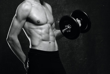 Fototapeta na wymiar young muscular man lifting weights