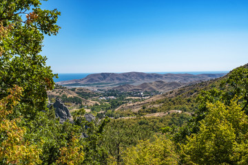 Fototapeta na wymiar Summer Crimean landscape with mountains and the sea on a sunny day.