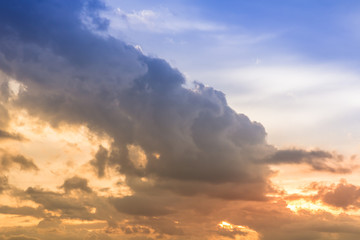 Light rain clouds and sunset