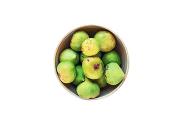 Bowl with green figs isolated on white, top view