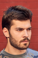 Obraz premium Young man posing in front of a camera.