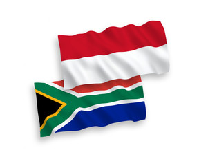 National vector fabric wave flags of Indonesia and Republic of South Africa isolated on white background. 1 to 2 proportion.
