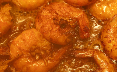 Shrimp fried in a pan in oil