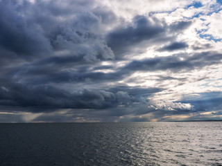 Fototapeta na wymiar Dark and dramatic storm clouds background.