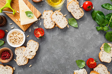 Italian food background. Ingredients for pesto, ciabatta bread and cherry tomatoes.  Italian...