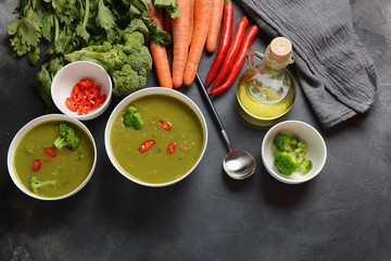 Healthy Vegan Creamy blended vegetable Soup puree with broccoli, celery, peas and carrots . Green...