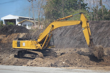 Fototapeta na wymiar construction machinery is working on road projects and building structures