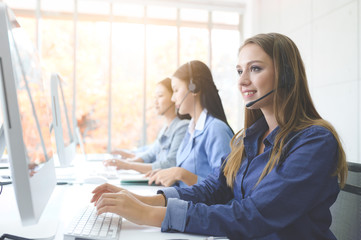 Call Center Service. Photo of customer support or sales agent.  Help line answering and telemarketing. Female caller or receptionist phone operator.Copy space for some text, advertising or slogan.