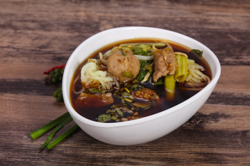 Thai style soup with meat and mushrooms
