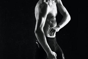 muscular man posing on black background