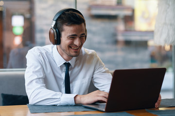 young businessman working on his laptop in office