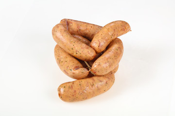 Tasty meat sausages over white background