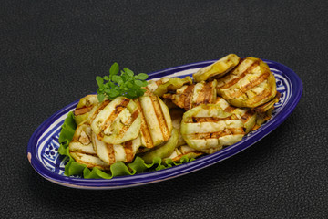 Grilled eggplant slices served basil