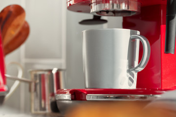 Modern kitchen. Red retro style coffee machine close up