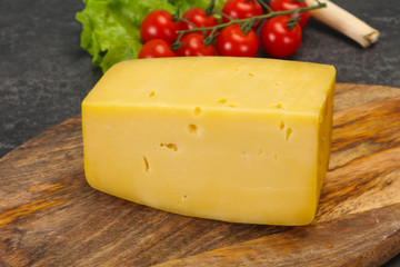 Hard yellow tasty cheese brick