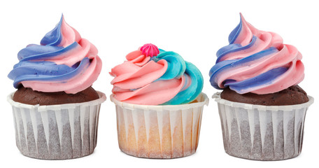 Three yummy cupcakes with icing  isolated on white background