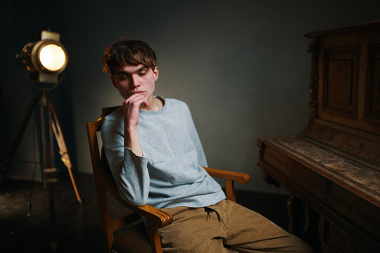 young man sitting on a chair