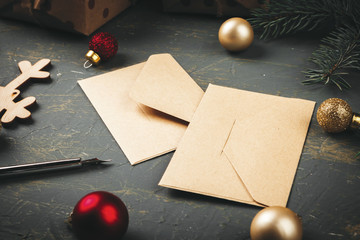 Christmas  background with letter, envelope and feather  pen surrounded by seasonal decorations