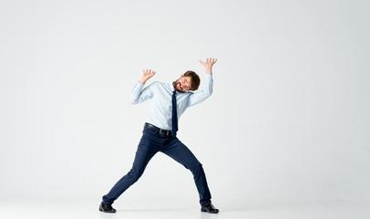Fototapeta na wymiar young man jumping on white background