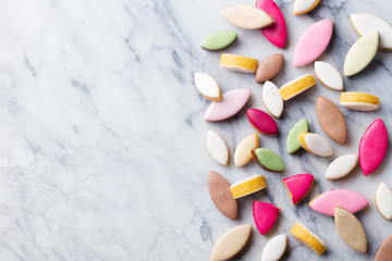 Calissons assortment on marble background. Traditional French Provence sweets. Top view. Copy space.