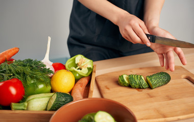 woman cutting vegetables in the kitchen
