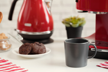 Cup of tea or coffee on modern kitchen background
