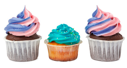 Three yummy cupcakes with icing  isolated on white background