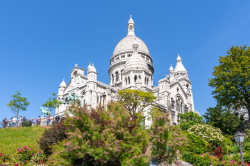 Fototapeta na wymiar Basilica of Sacre Coeur (Sacred Heart) on Montmartre hill, Paris, France