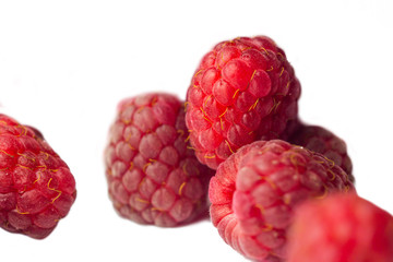 red raspberry berries close-up isolated on a white background. sweet summer medicinal berries macro details