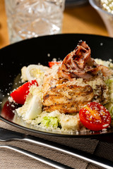 Meat salad with cheese and tomatoes
