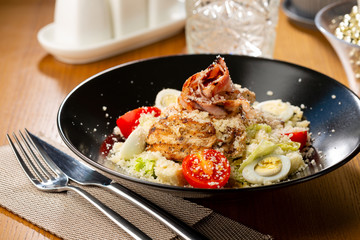 Meat salad with cheese and eggs close-up