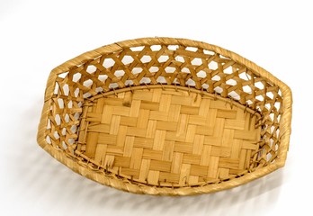 Woven birch bark utensils for bread on a white background