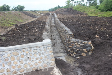 irrigation structure of rice fields beside the road