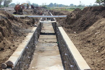 irrigation structure of rice fields beside the road