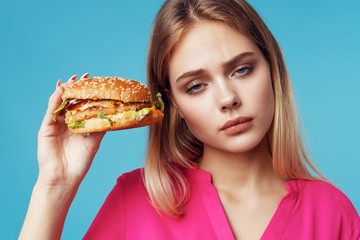 young woman with hamburger