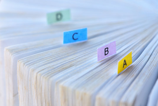 White book with alphabet bookmark