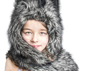 Cute girl in a fur hat with cat's ears on a white background. Isolated.