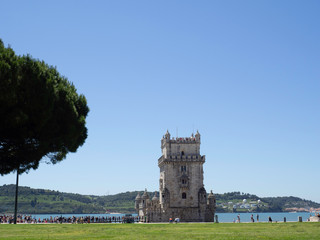 Lisbon, Portugal - May 11, 2019: Long queues of tourists awaiting to visit the Belem Tower. The building is listed as UNESCO World Heritage Site and it is a big tourism attraction in the city. 