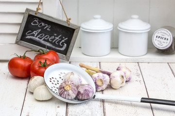 White Kitchen With Garlic And Tomatoes And Sign Bon Appetit