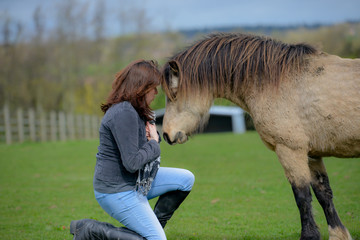 Girl and old pony having a sentimental moment. 