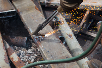 worker and fire gas cutting steel