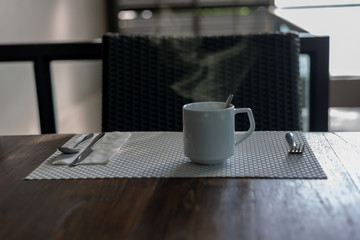 Coffee in a white cup on the table