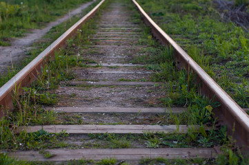 railway rails.old narrow gauge railway. road for the carriage of freight cars. rusty rails