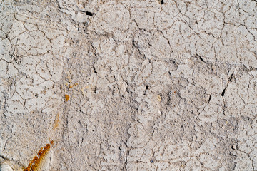 The texture of a concrete wall. Surface with scratches, scuffs, cracks. Gray color of surface....